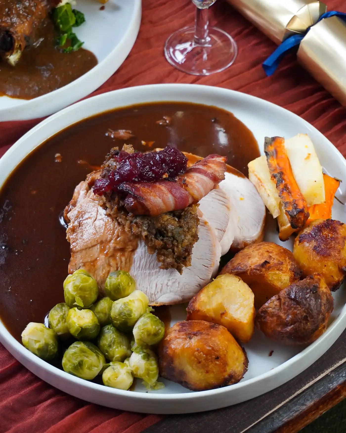 Photo of a roast turkey Christmas dinner with gravy and all the trimmings