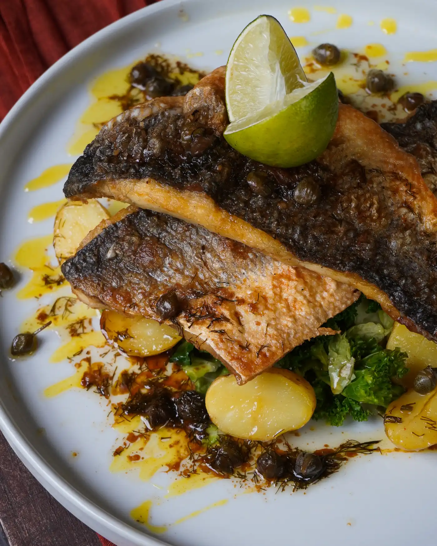 Photo of a plate close up with the sea bass dish